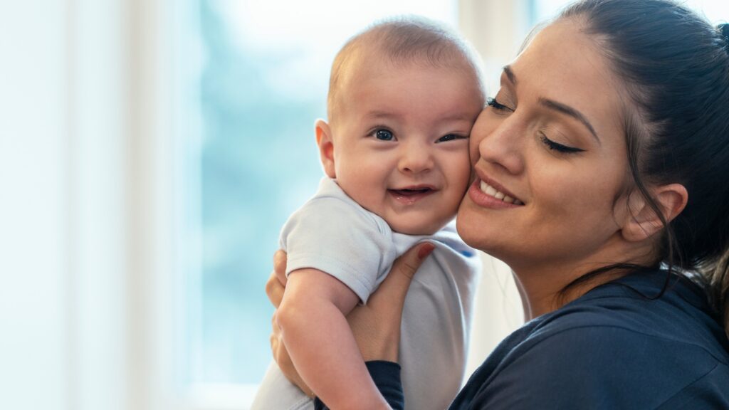 baby and mother cheek to cheek
